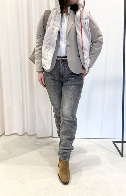 White down vest layered over a jacket for a refined casual style
