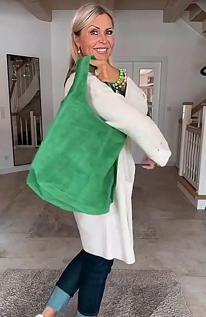 Green large shoulder bag with white coat and denim