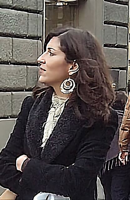Large circular earrings with black coat and white inner top