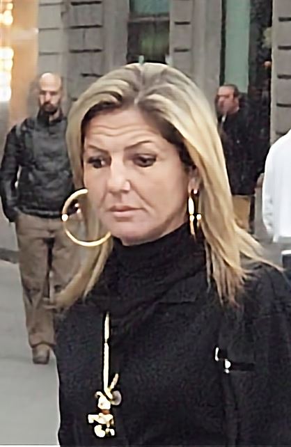 Large hoop earrings with black top and gold necklace