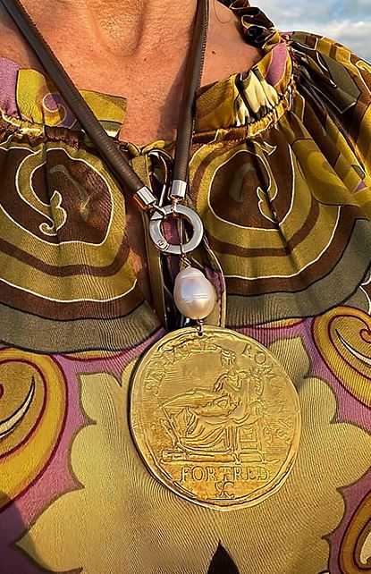 Gold pendant necklace with colorful patterned top