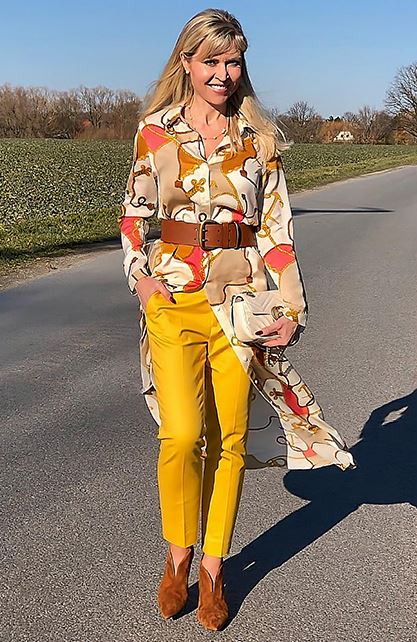 Yellow pants and patterned shirt with a brown belt